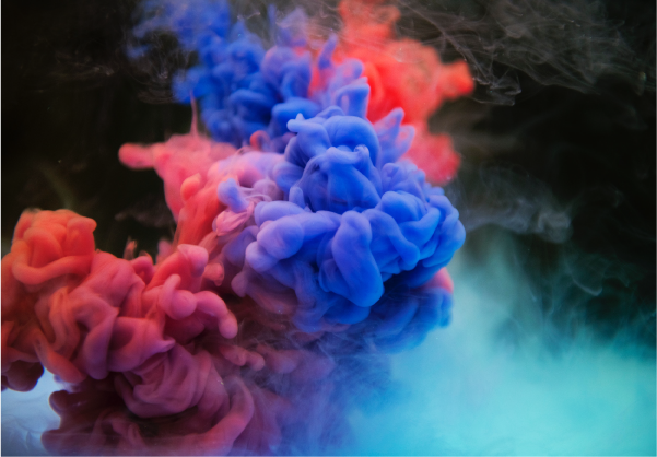 Explosion of red and blue ink creating powder cloud